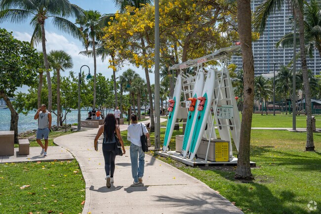 Residents walking through Margaret Pace Park in Media and Entertainment District.