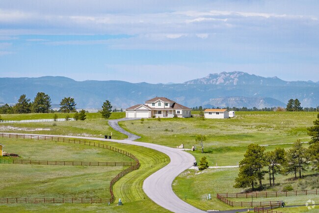 Estates in Ponderosa Park can have craftsman influences and enjoy a most beautiful setting.