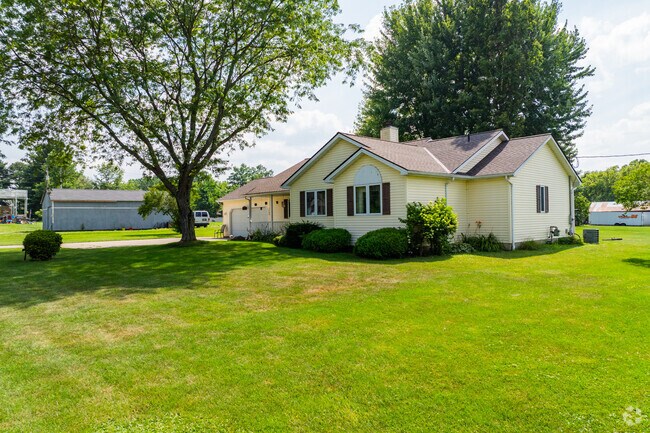 Quaint houses in Grafton showcase small-town charm and tidy landscaping.