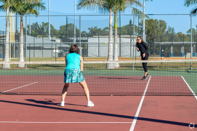 There are several tennis courts at Bonita Springs Community Park near Arbel.