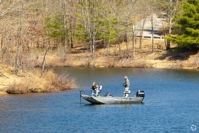 Two fisherman float on Mansfield Hollow Lake, near Scotland.