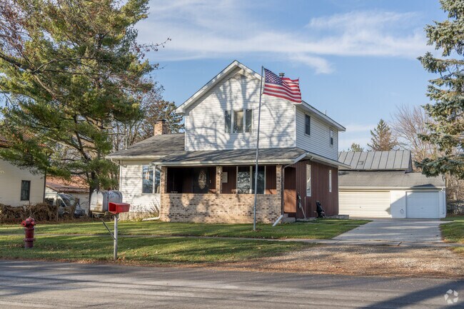 A two story house with a front porch in the village of Vermontville.