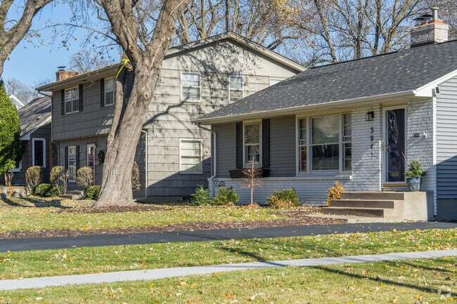 Two homes of various styles stand in Pamela Park, Edina.