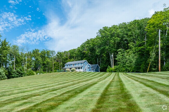 Some New Hampton properties have large lawns that give homes a certain prominence.