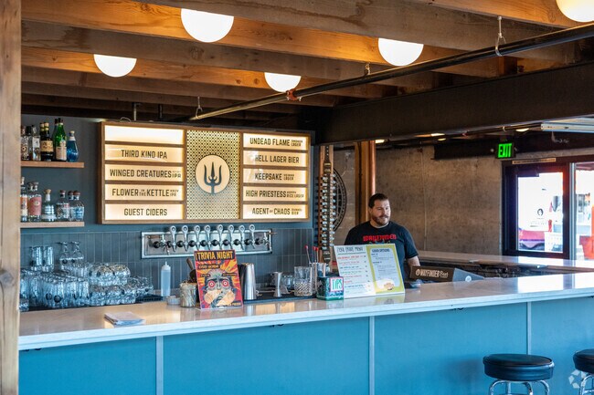 Bartenders offer guidance when choosing from many of the local beers at Wayfinder Beer.
