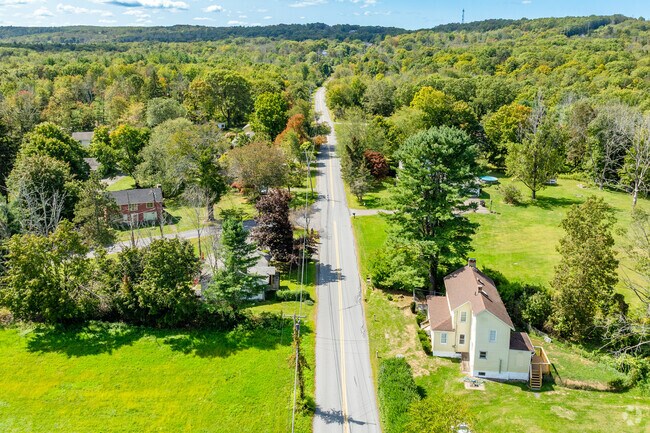 Greenville Town’s rural charm includes homes nestled among trees and rolling terrain.