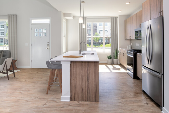 Upgrade Scheme townhome kitchen and dining areas with hard surface flooring