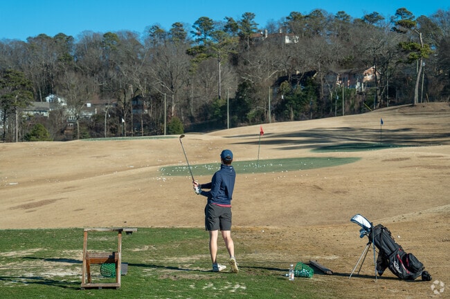 Hit your next hole in one at Highland Park Golf Course near Redmont Park.