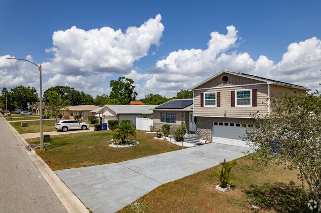 Pine Lake Estates features various housing styles, including single-story and split-level homes.