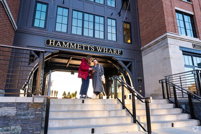 Local visitors discover their next activity while enjoying the sights around Historic Hill, RI.