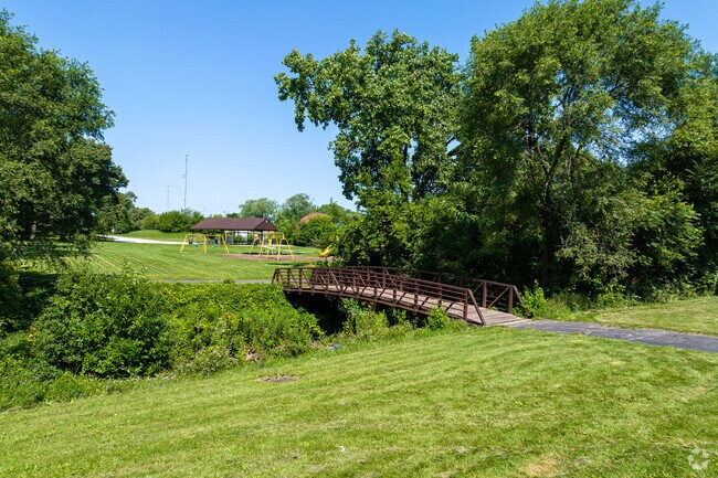 At one of the many green spaces a bridge crosses over a creek in Hazel Crest Proper.