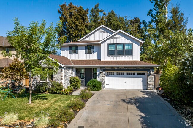 This traditional style home with a rock face siding is very classy in South Davis.