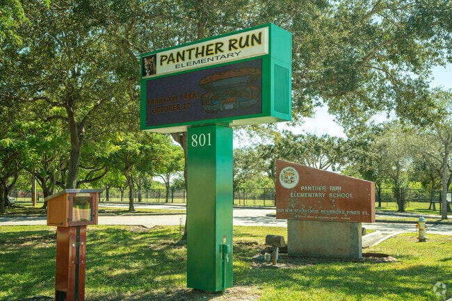 Panther Run Elementary School Signage Under the Trees with The Book Box for Wants Read