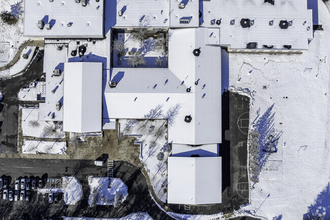 An aerial top-down view of Old Hammondtown Elementary in Mattapoisett, MA.