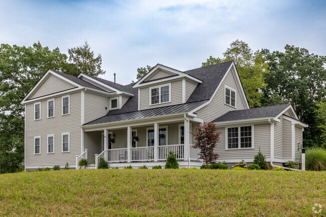 Renovated 1950s farmhouses appear alongside newer builds in Marshfield.