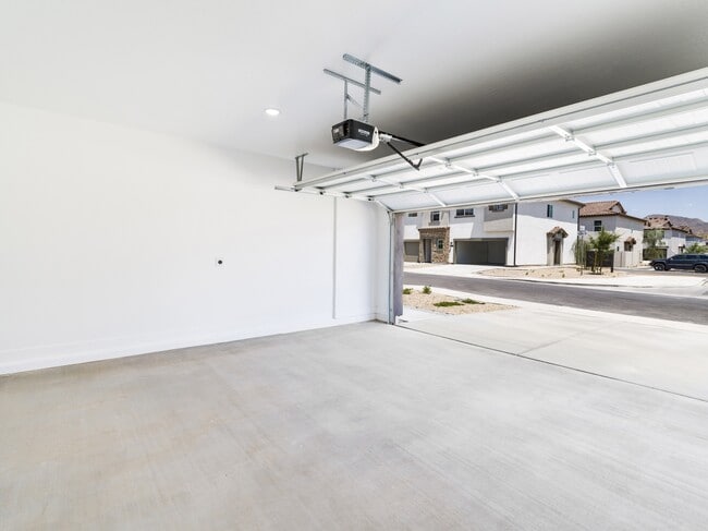 Discover the convenience of upscale living at Amavi Aster Ridge, where 1- and 2-car front garages, along with driveways, provide ample parking and storage space right at your doorstep.