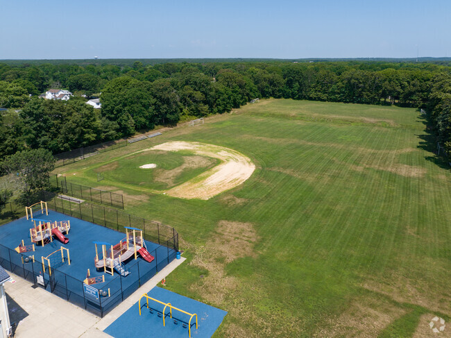 East Moriches Elementary School features a playground, baseball diamond and a field.