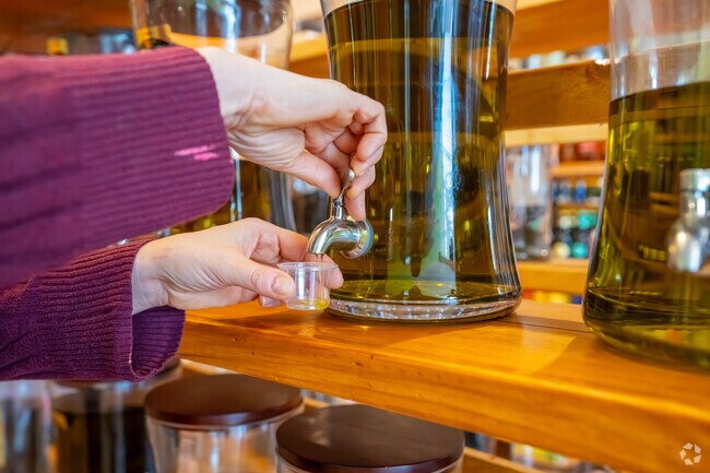 Taste before you buy any of the olive oils offered at Art's Specialties in Waverley Square.