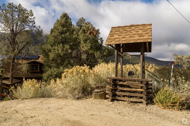 Pine Mountain Club's rustic allure lies in its rugged terrain, wooden cabins, and natural charm.