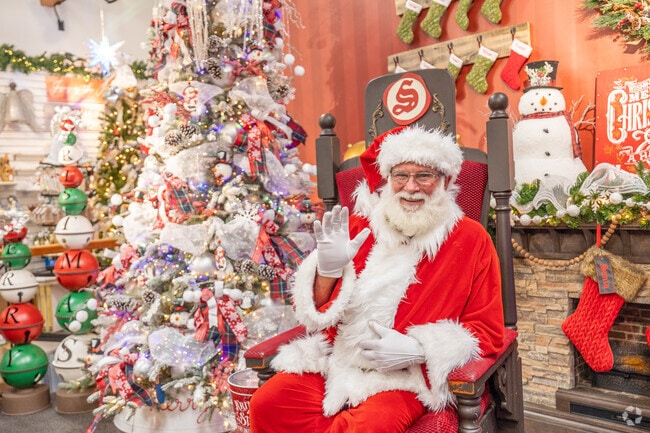 Santa greets visitors with festive cheer at Santa Claus House in Badger.