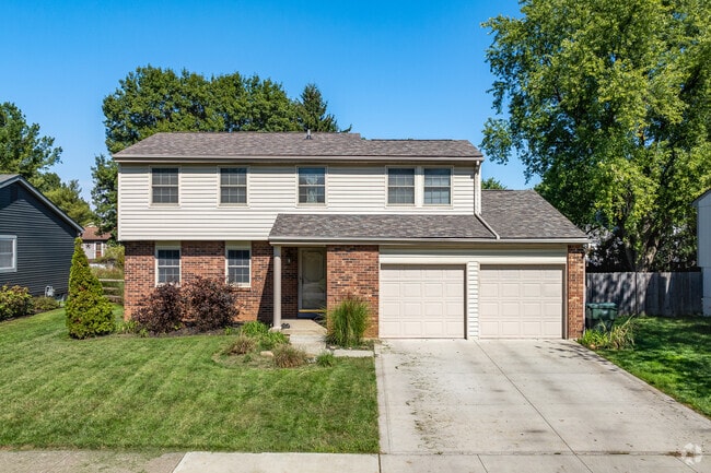 A two-story home in Smoky Ridge Estates features an attached two-car garage.