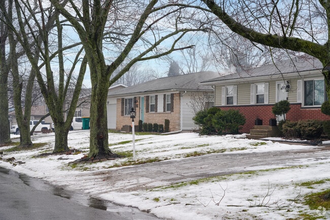 Houses in West Merrillville have generous yards with mature trees.