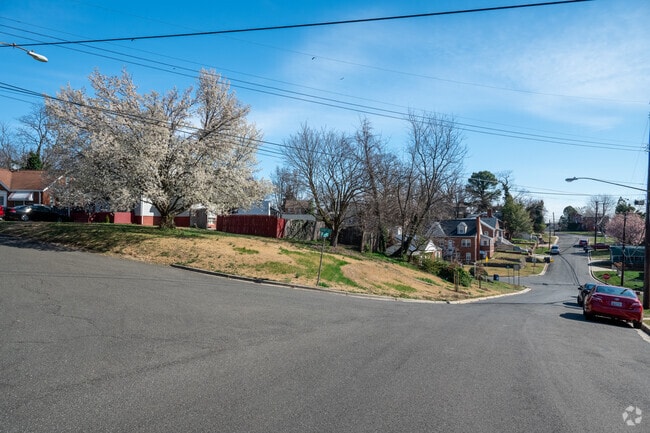 Coral Hills is aptly named, with rolling hills and tree-lined slopes that give the neighborhood its unique charm.