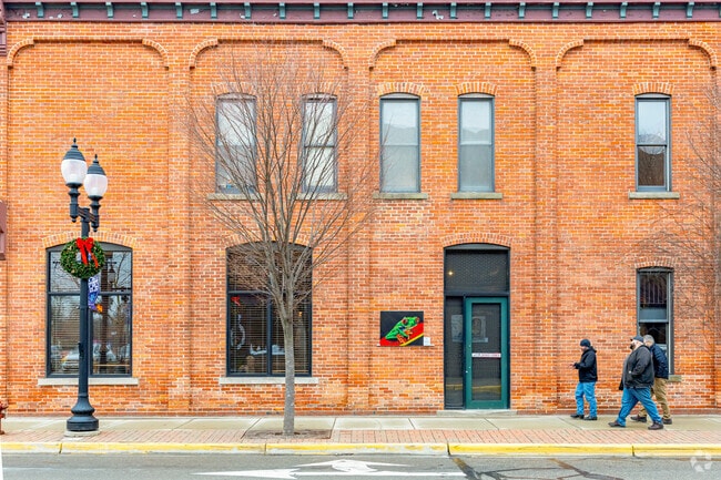 Locally-made art hangs on historic buildings throughout Saline's walkable downtown.