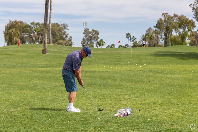 Residents practice their golf game at the Sun Lakes Country Club.