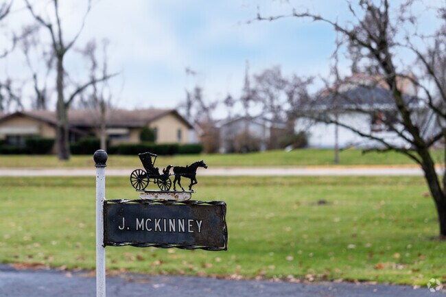 Custom house name plates on the front lawn of a Paddock Lake house.