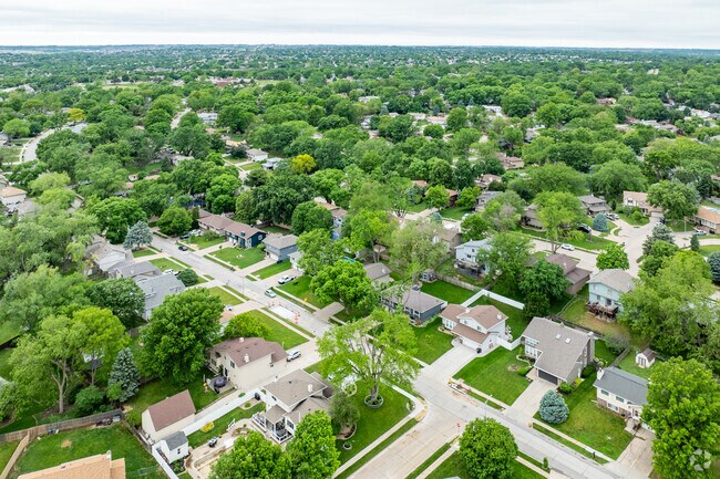 Tree-lined streets create a peaceful atmosphere to the Stony Brook neighborhood.