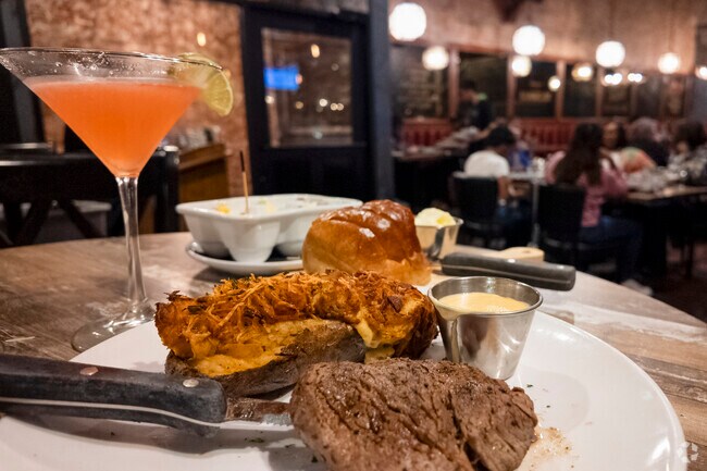 Savor a delicious steak dinner at The Gin Mill, a local favorite in Millikin Home.