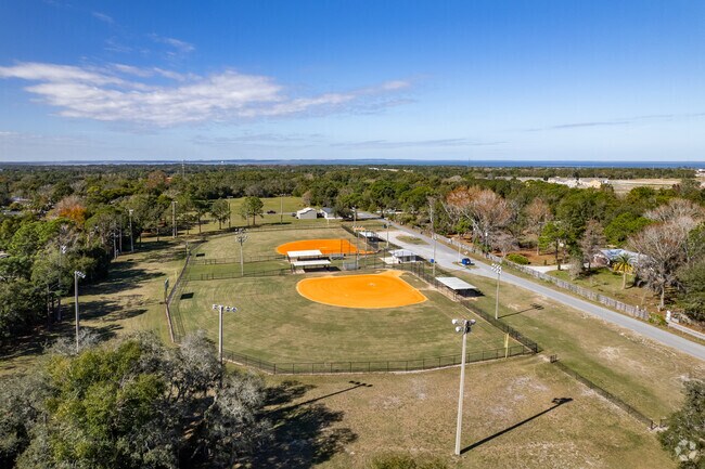 Families gather to see their kids play baseball on the fields of Vignetti Park  in Ocoee.