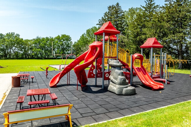 Modern playground equipment in school colors ensures fun recess time.