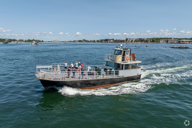 A local boat tour passes through the shores of Woods Hole