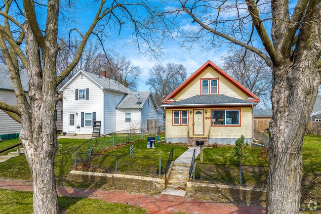 Cobblestone sidewalks and updated homes line this Capitol East street.