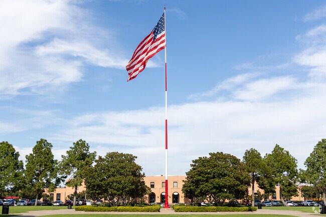 The towering flag at Ingram Plaza stands as a proud beacon in the heart of Liberty Station.
