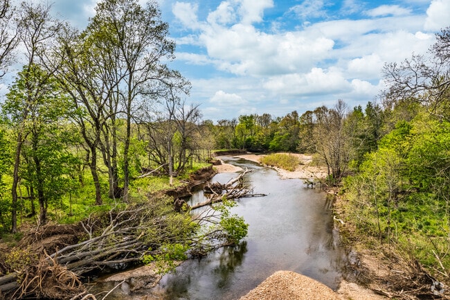 Creek winds through a quiet park in Marshfield's residential area.