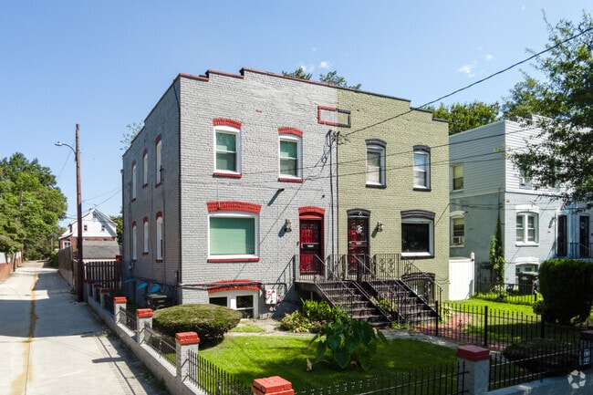 Older, federalist-style semi-detached brick row homes are a common find in Benning Heights.