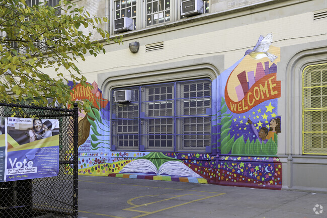MS 363 where students walk pass beautiful artwork to enter building.