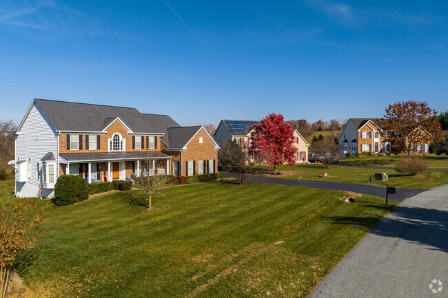Opulent row of new constructed colonial homes nestled on large lots in Woodsboro.