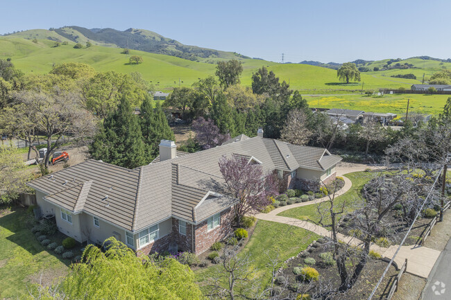 Pine Creek homes typically feature large lots and long driveways.