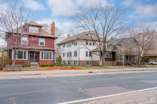 A pair of Foursquare homes with varied styles sit on the left in Ventura Village, Minneapolis.