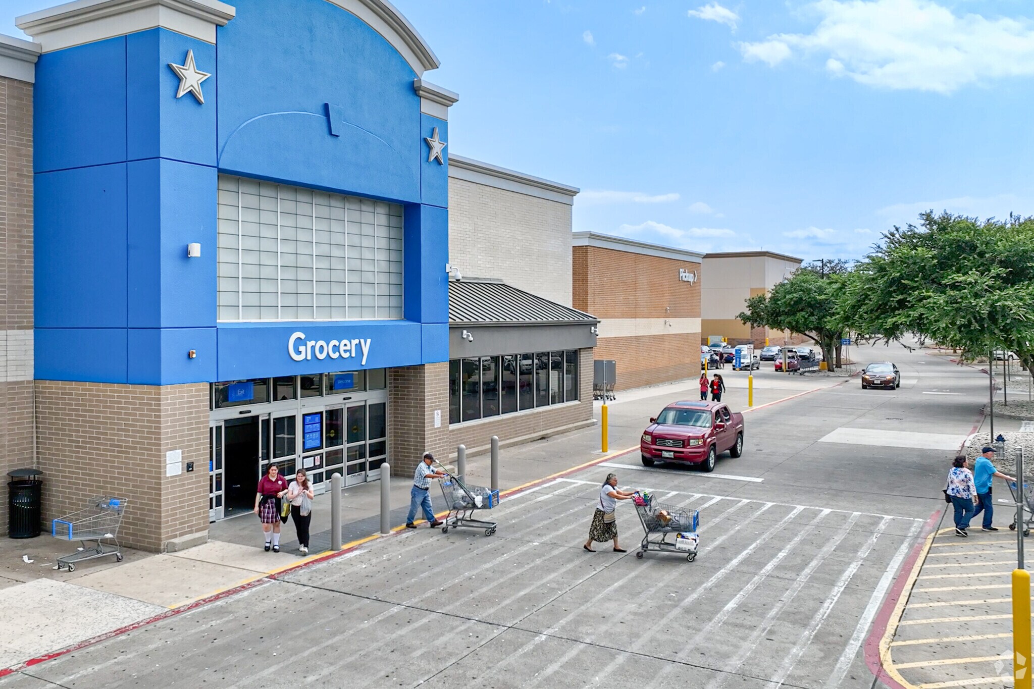 Camelot residents go shopping at the local Walmart for groceries.
