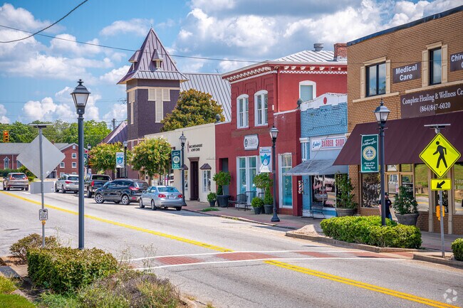 Retail shops in the historical buildings of Williamston line main street running through town.