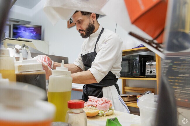 Making a freshly prepared sandwich at New Milford Bagels in New Milford, NJ.