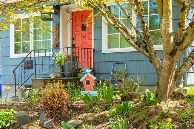 A brightly colored door and matching lawn art in Kenton.