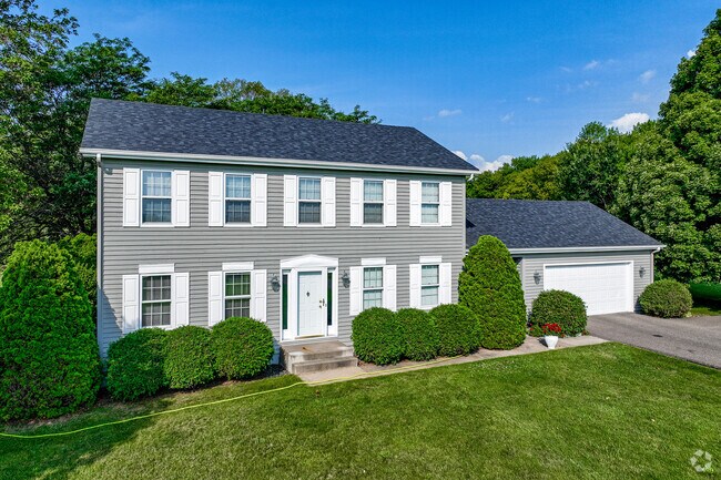 Colonial revival-style homes overlook Lake Independence.