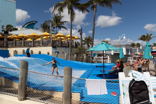Liberia locals thoroughly enjoy the artificial wave on Hollywood Beach.