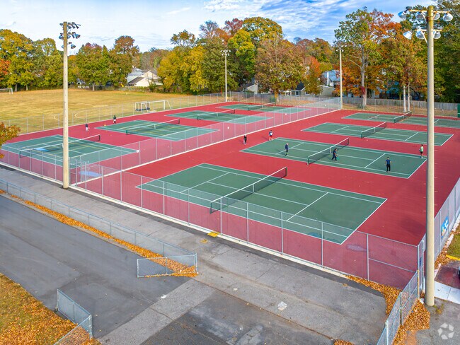 Locals enjoy the courts at Green Run High School for a game of tennis.